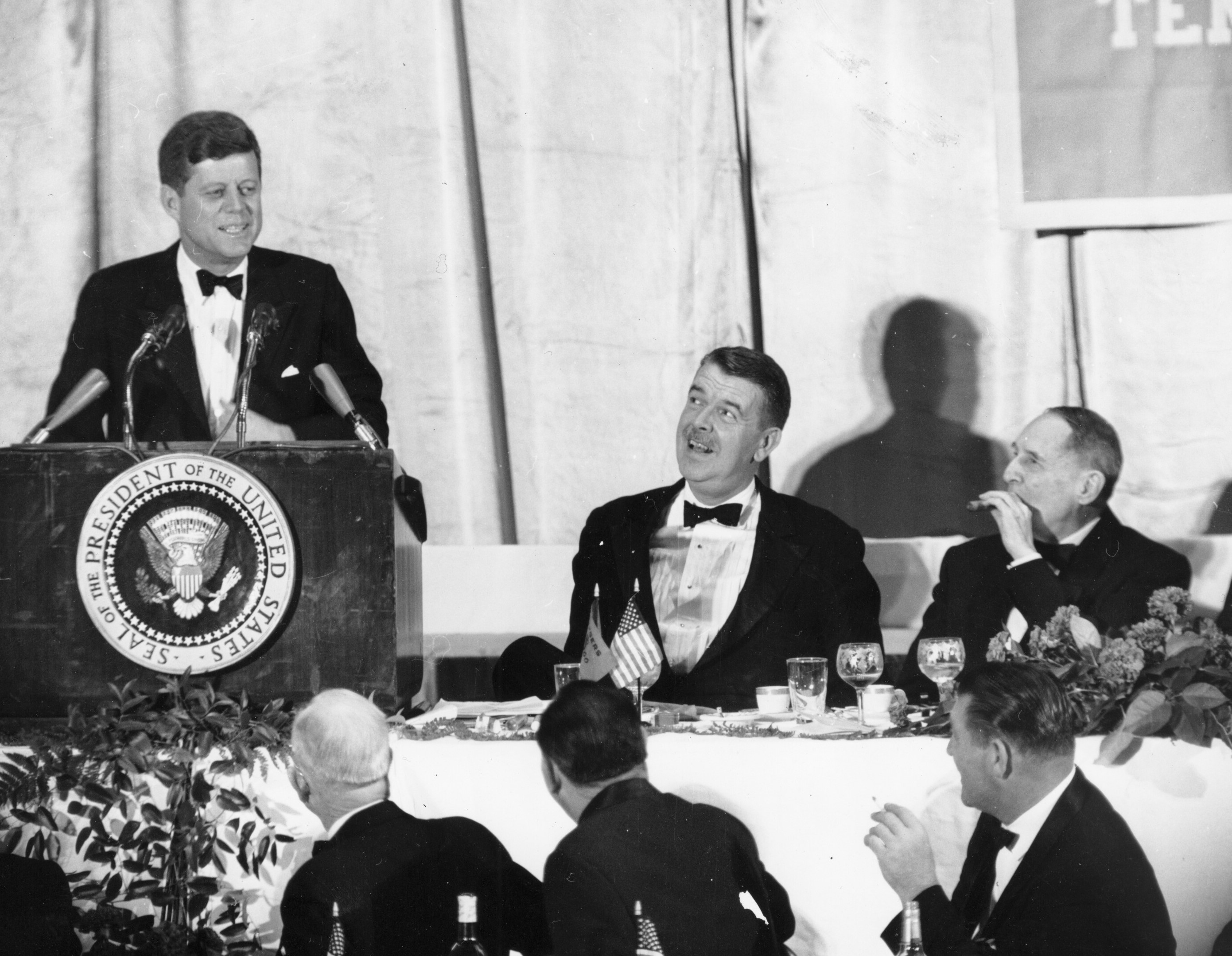 President John F. Kennedy at a College Football Hall of Fame (Rutgers was then vying to be the site of the HOF) dinner with Rutgers University President Mason Gross (1959-1971) and General Douglas MacArthur in December 1961.